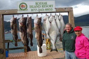Mike Dunham and Karen King stand in front of their limits of halibut and ling cod.